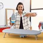 Woman holding an iron next to LivinH Foldable Ironing Board in a home setting.