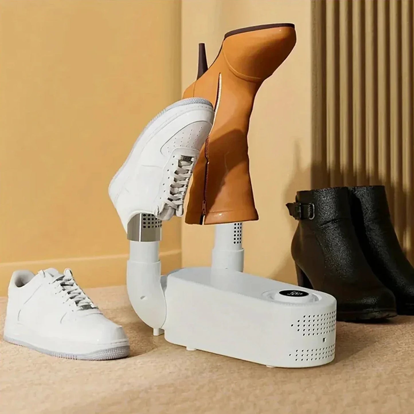 LivinH Portable Shoe Dryer drying white sneakers, brown boots, and black boots on a beige background